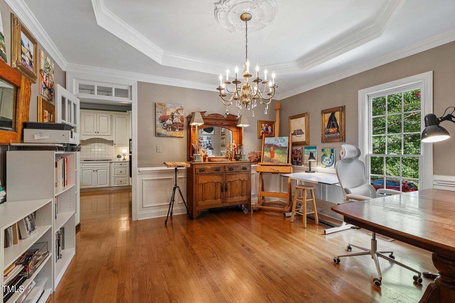 500 Potomac Grove Place Cary, NC 27519 - Photo 22 of 77 a view of a dining room and livingroom with furniture wooden floor a chandelier
