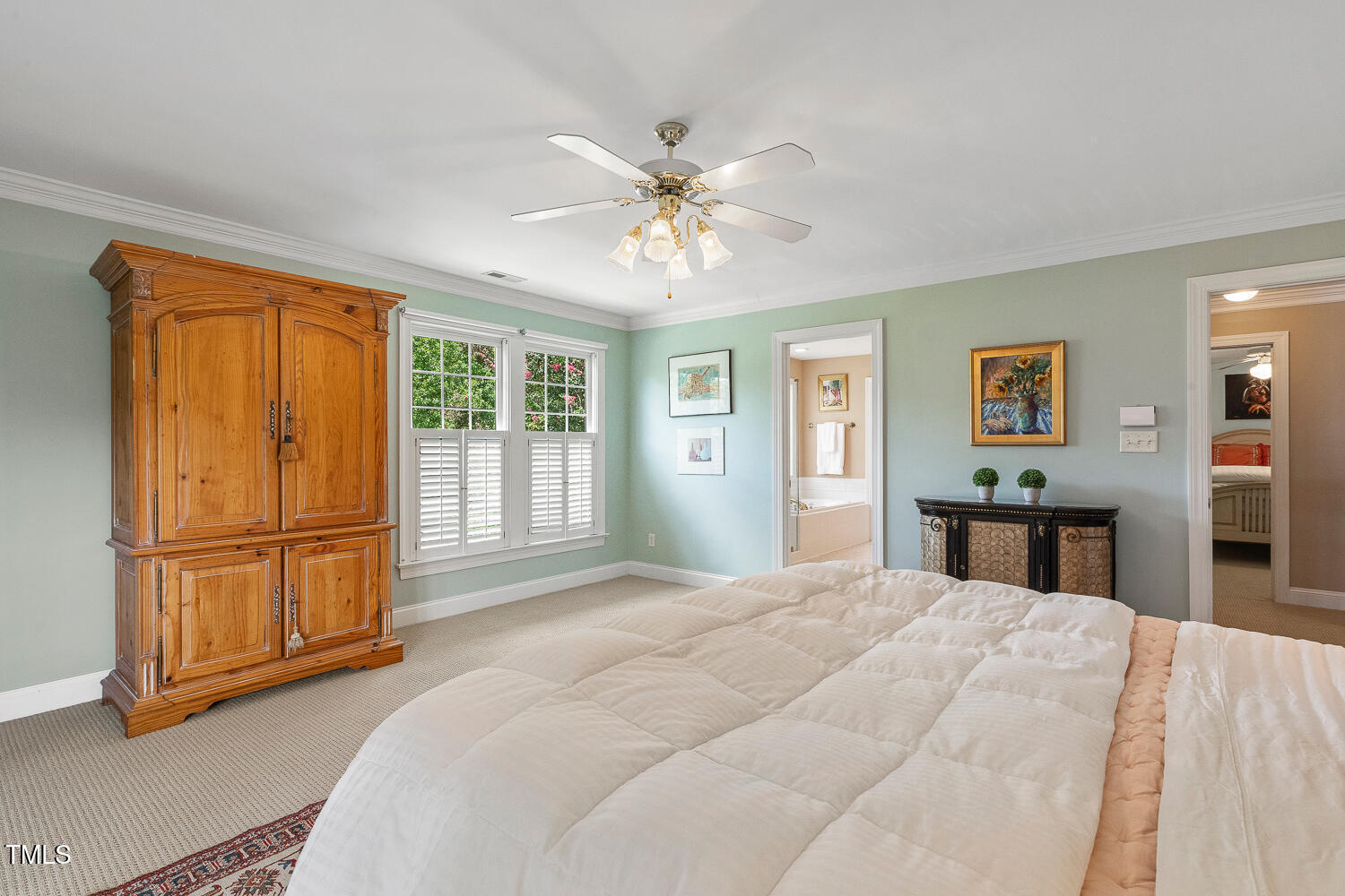 500 Potomac Grove Place Cary, NC 27519 - Photo 31 of 77 a bedroom with a large bed and a chandelier