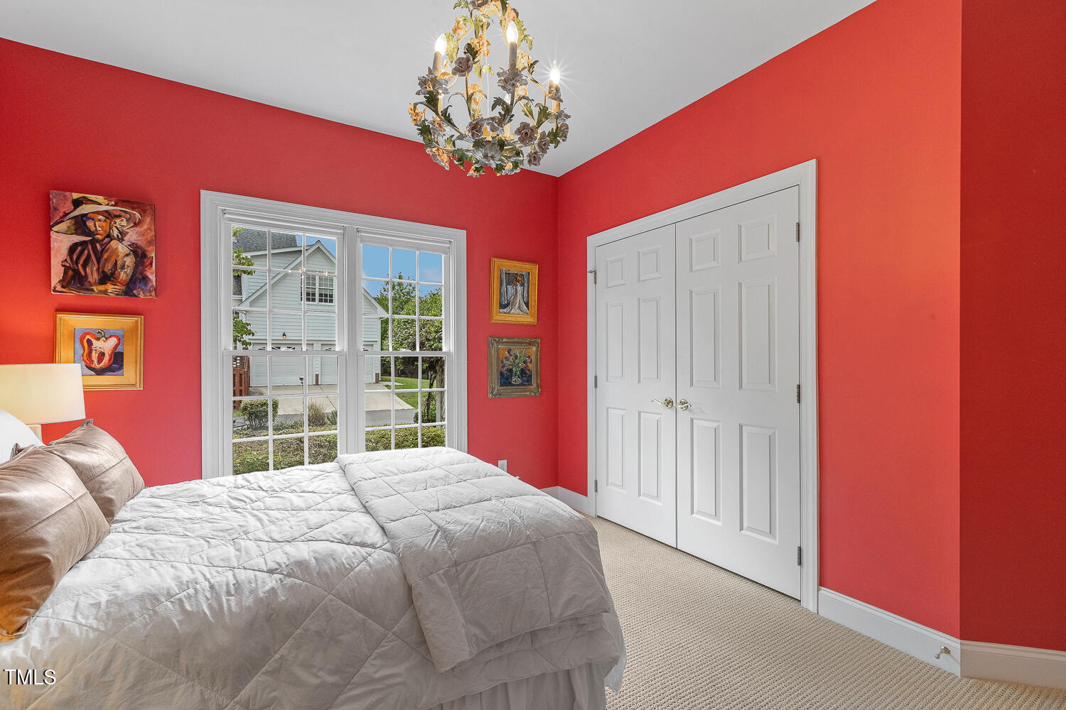 500 Potomac Grove Place Cary, NC 27519 - Photo 44 of 77 a bedroom with a large bed and a chandelier