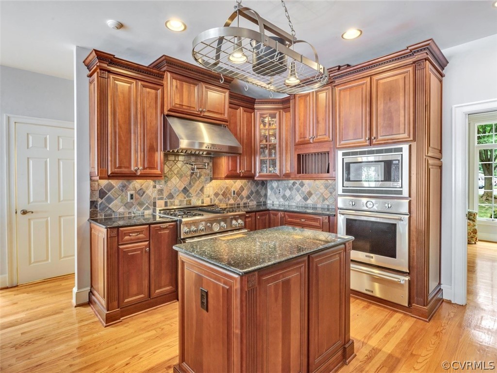 13702 Beechwood Point Road Midlothian, VA 23112 - Photo 13 of 50 a kitchen with stainless steel appliances granite countertop a sink stove and refrigerator