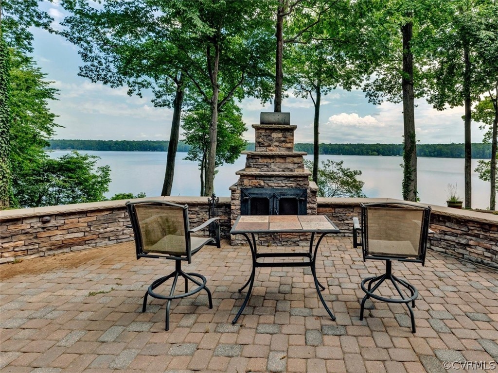 13702 Beechwood Point Road Midlothian, VA 23112 - Photo 36 of 50 a view of a terrace with furniture and a table