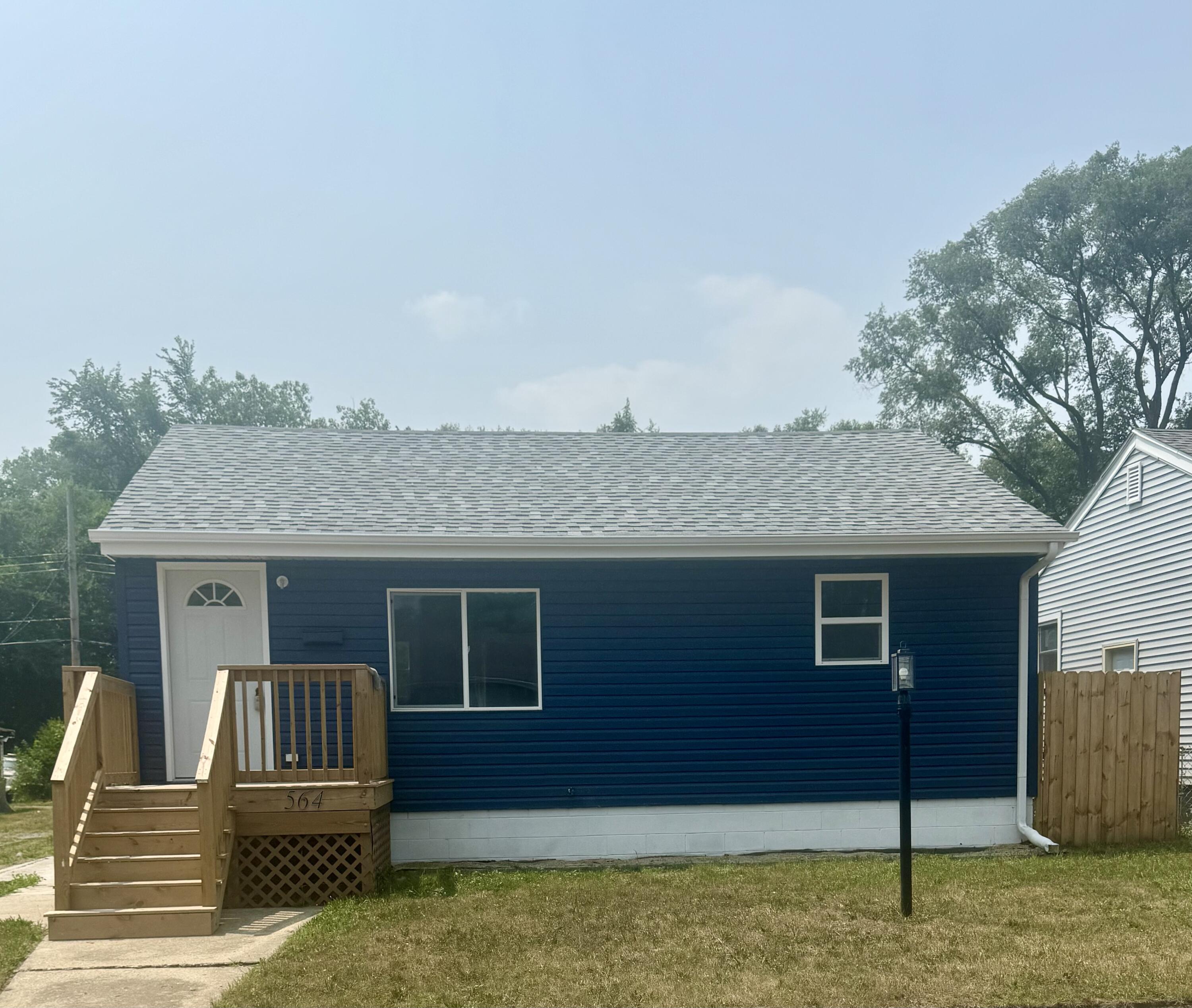 564 Hamlin Street Gary, IN 46406 - Photo 1 of 14 a house view with a garden space