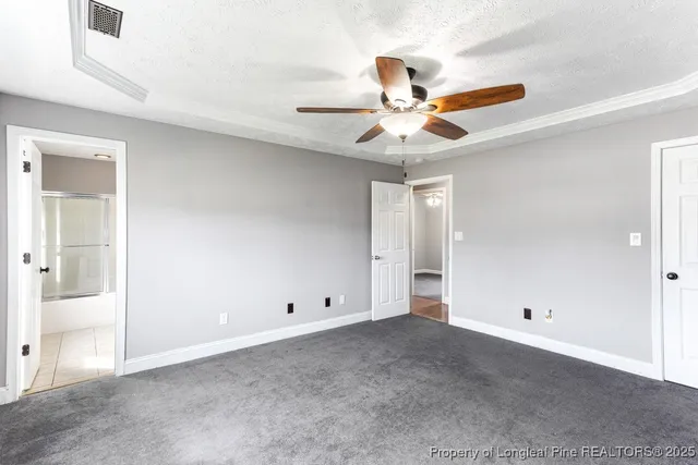 a bathroom with a granite countertop sink toilet a mirror and shower