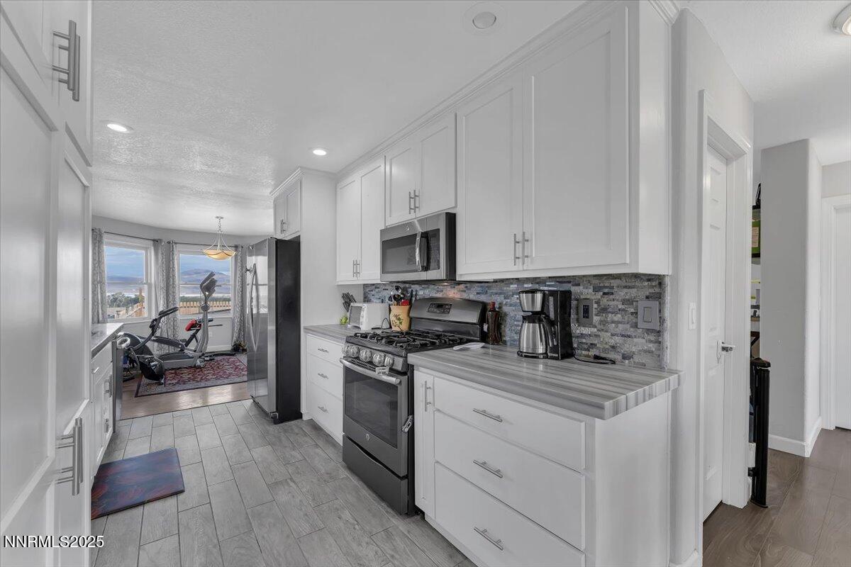 20 Simons Road Fernley, NV 89408 - Photo 12 of 56 a kitchen with sink stainless steel appliances and cabinets
