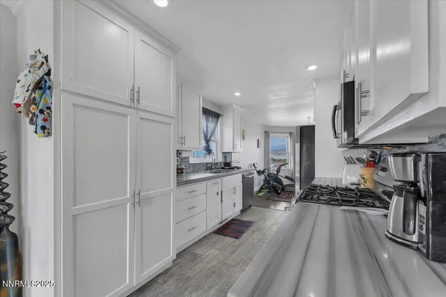 a view of a dining room with furniture and window