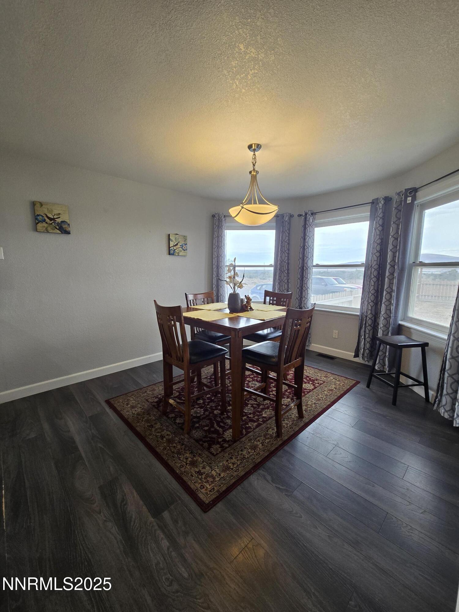 20 Simons Road Fernley, NV 89408 - Photo 14 of 56 a view of a dining room with furniture and window