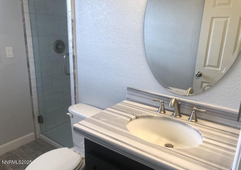 20 Simons Road Fernley, NV 89408 - Photo 15 of 56 a bathroom with a sink and toilet