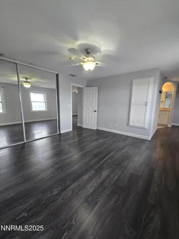 a room with wooden floor and a sink