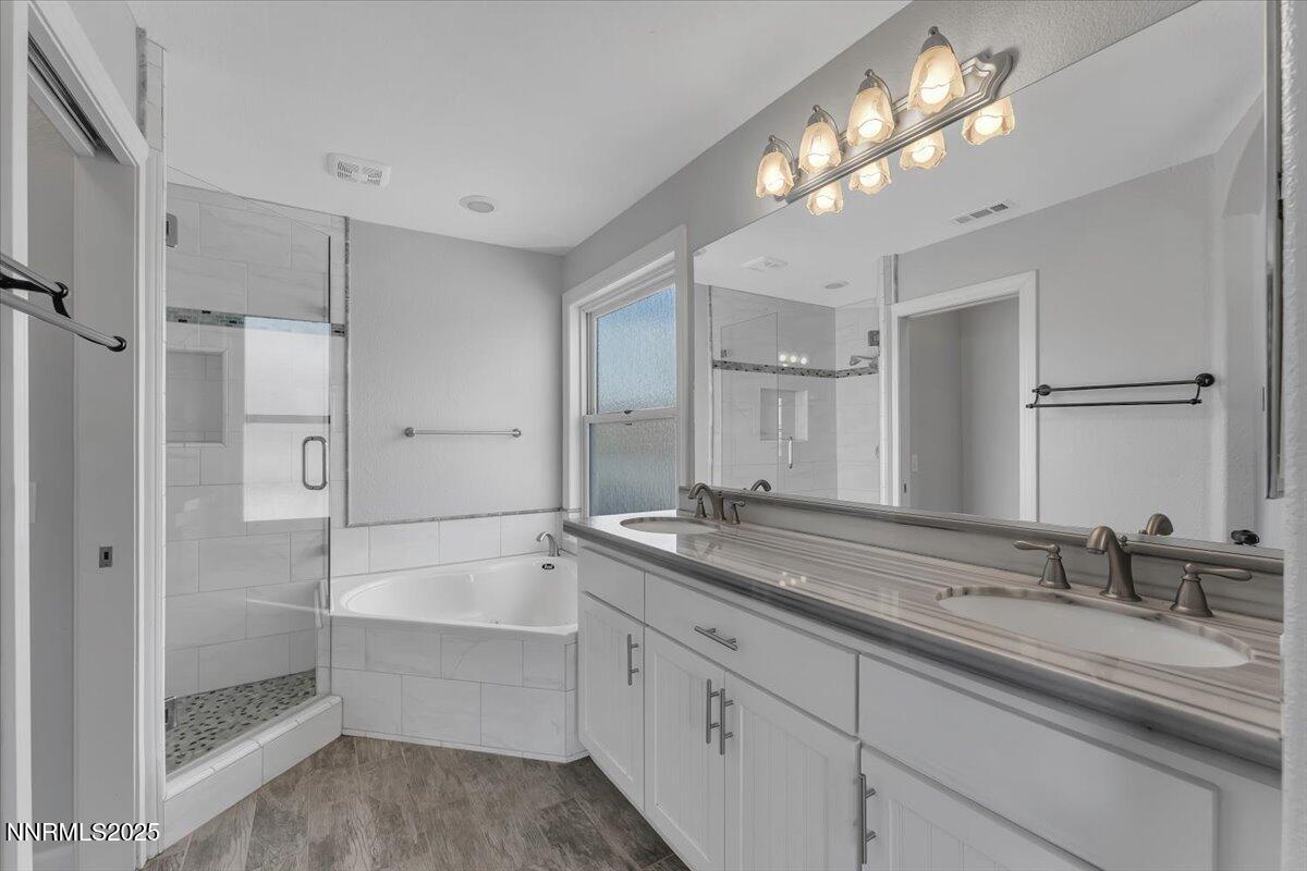 20 Simons Road Fernley, NV 89408 - Photo 21 of 56 a bathroom with double vanity sinks and a shower