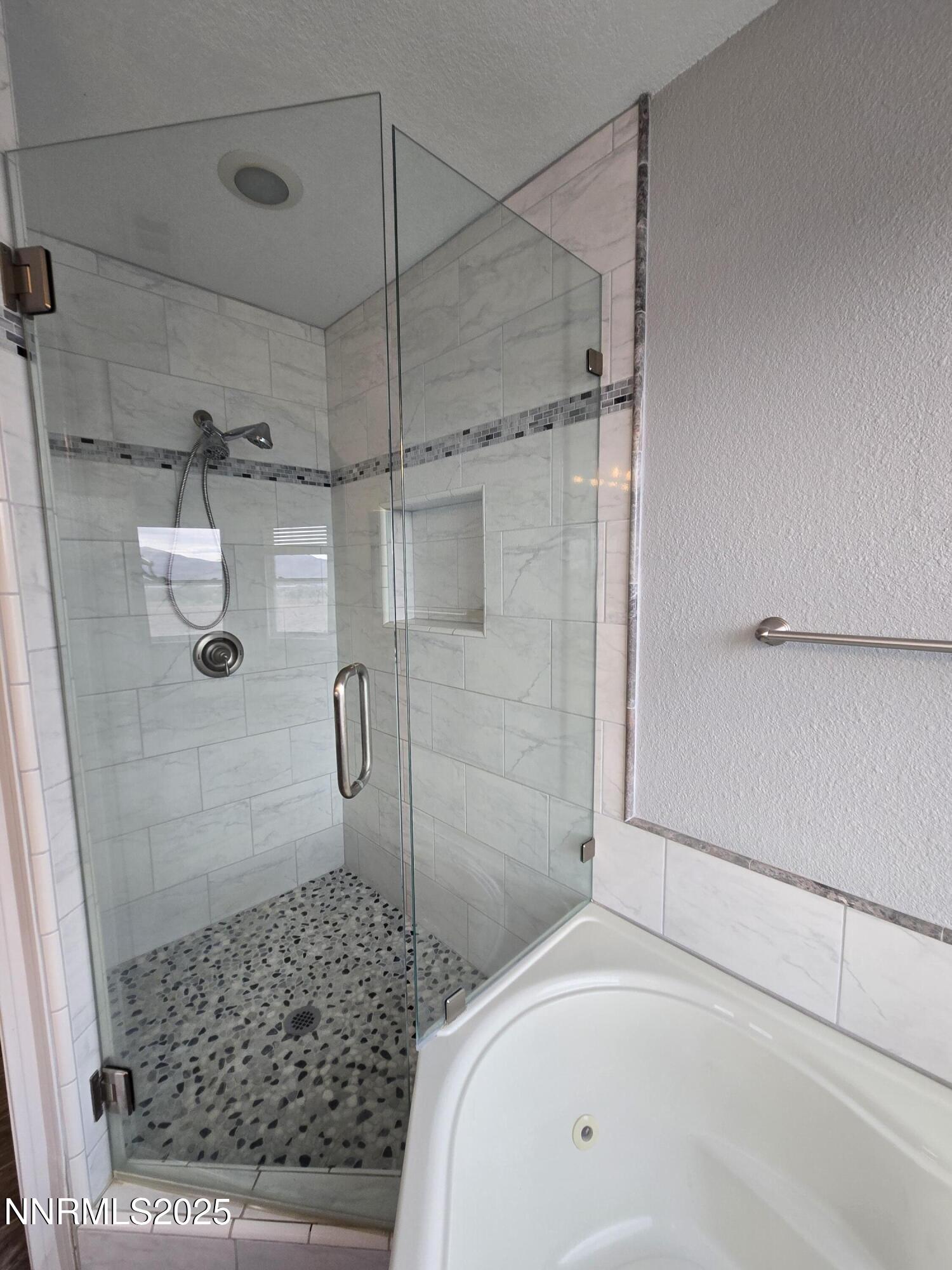 20 Simons Road Fernley, NV 89408 - Photo 22 of 56 a bathroom with a bathtub and a shower