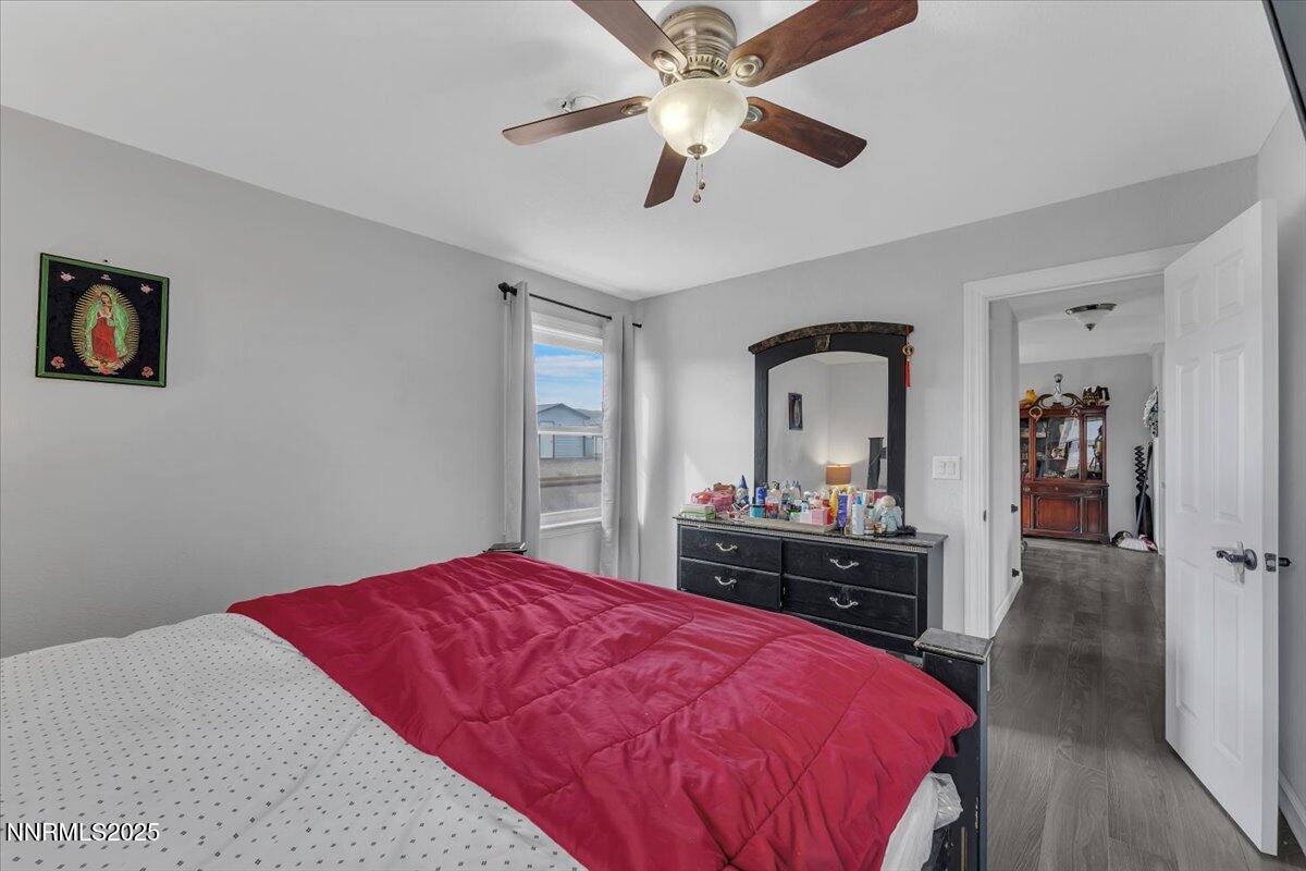 20 Simons Road Fernley, NV 89408 - Photo 24 of 56 a bedroom with a bed and a dresser