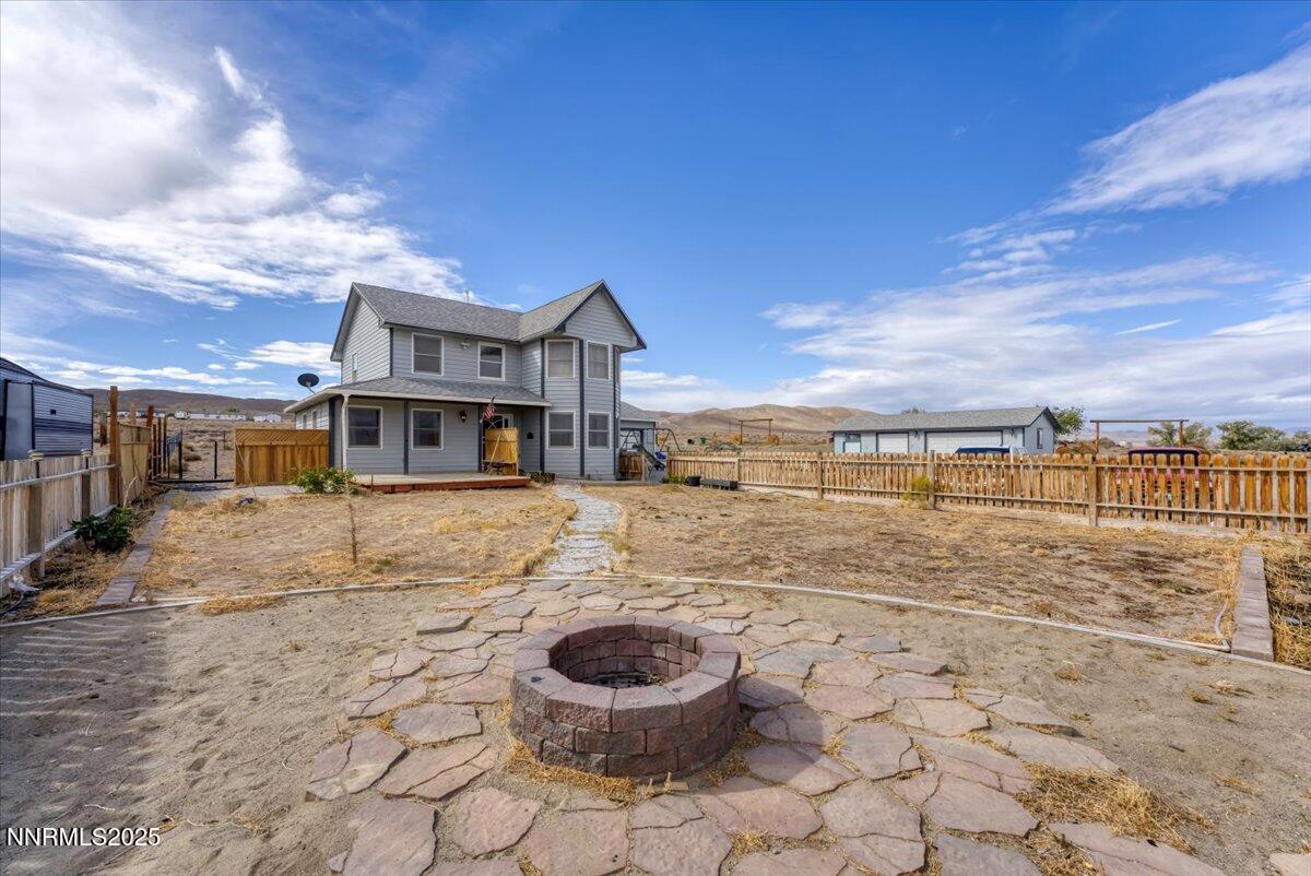 20 Simons Road Fernley, NV 89408 - Photo 30 of 56 a view of a house with a yard and furniture