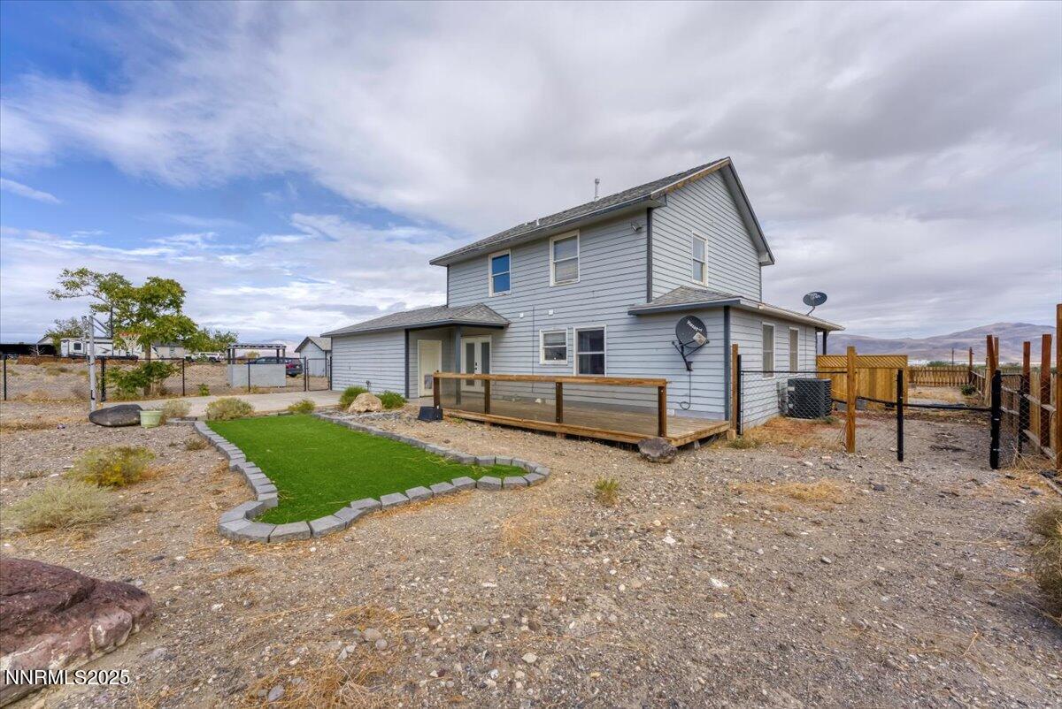 20 Simons Road Fernley, NV 89408 - Photo 36 of 56 a view of a house with backyard and a tree