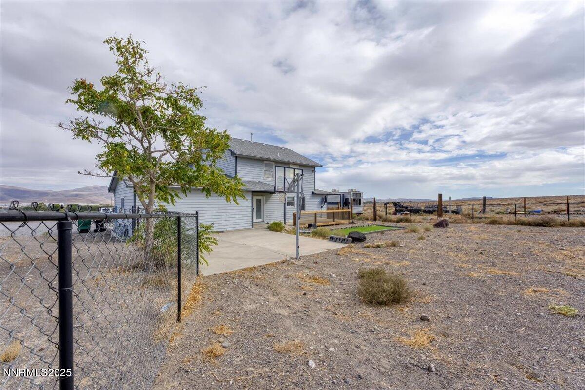 20 Simons Road Fernley, NV 89408 - Photo 37 of 56 a view of a dry yard with lots of palm trees