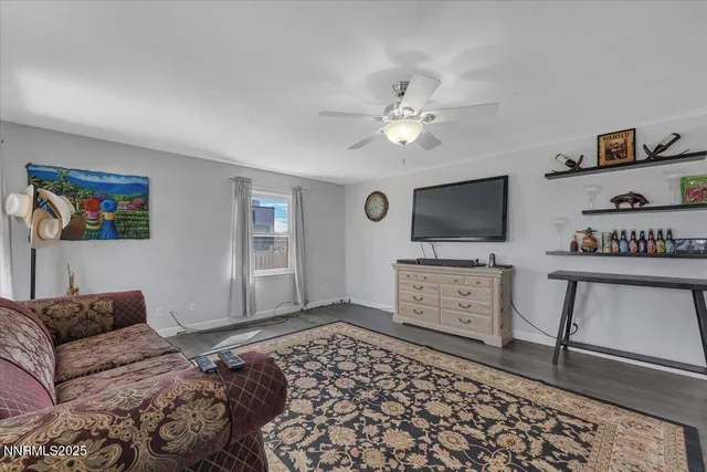 a bedroom with furniture and a rug