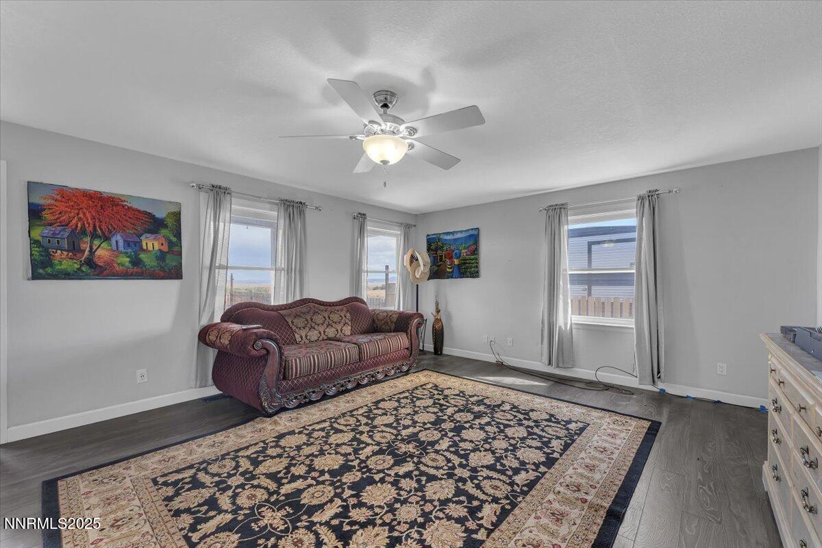 20 Simons Road Fernley, NV 89408 - Photo 6 of 56 a bedroom with furniture and a rug