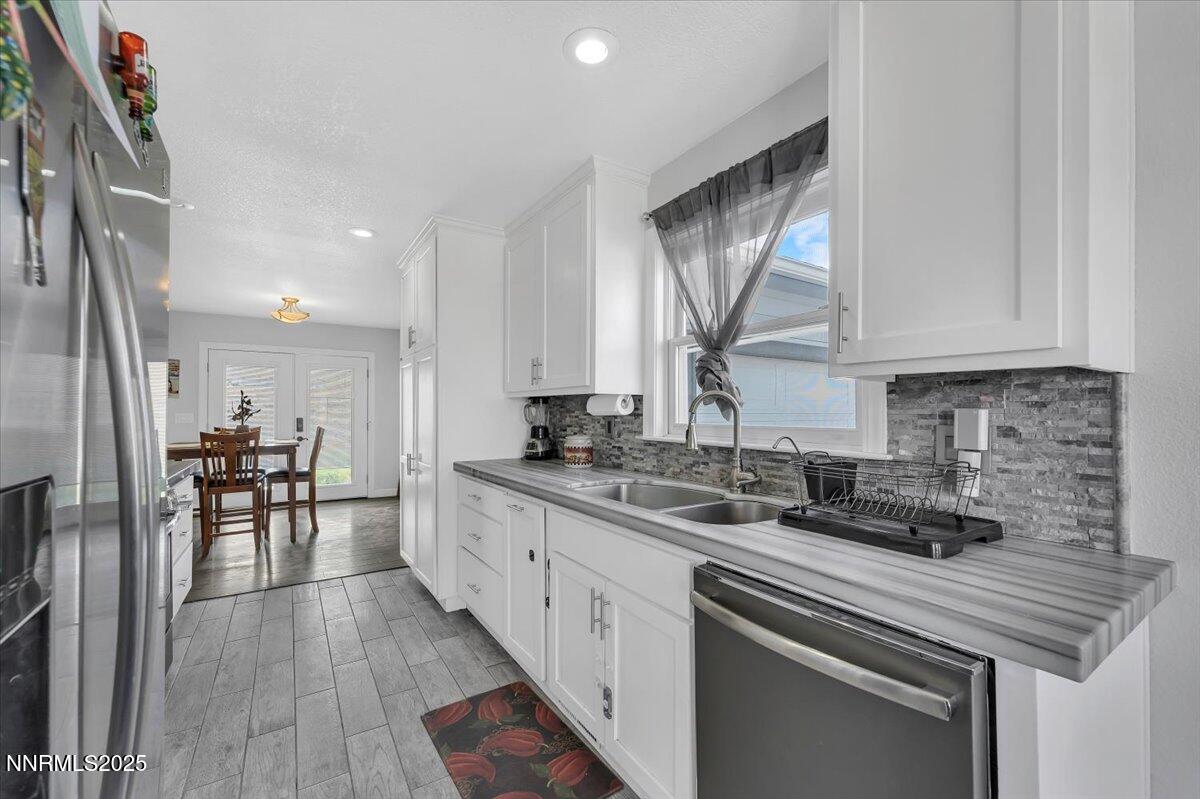 20 Simons Road Fernley, NV 89408 - Photo 8 of 56 a kitchen with a sink cabinets and window