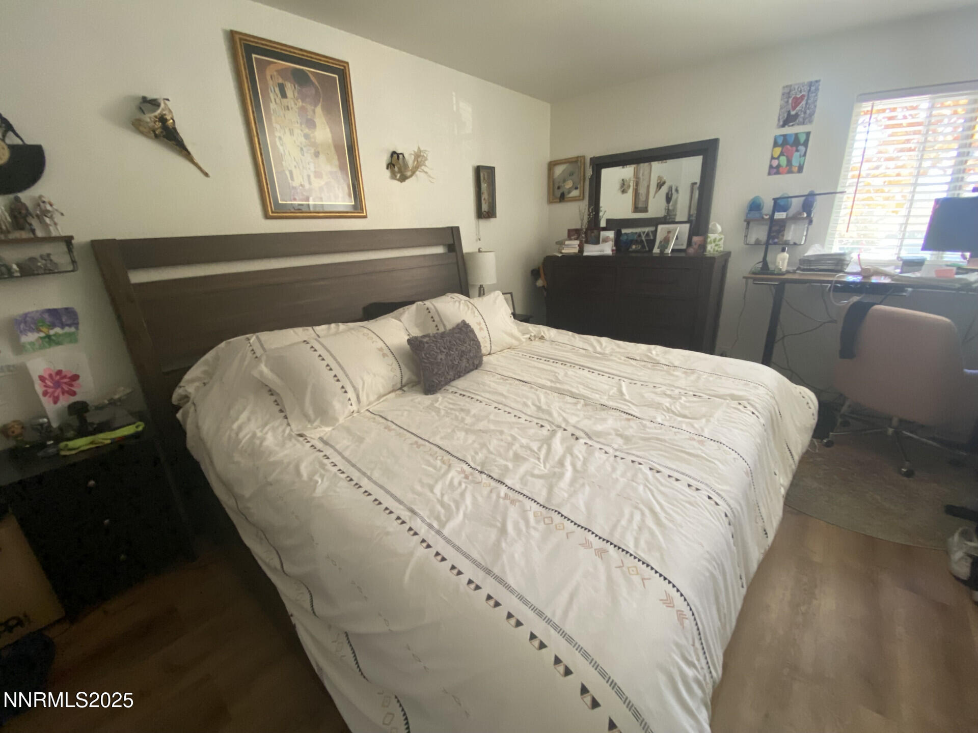 2955 Lakeside Drive, Unit 217 Reno, NV 89509 - Photo 7 of 10 a bedroom with a bed and wooden floor