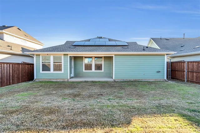 a house view with a backyard space