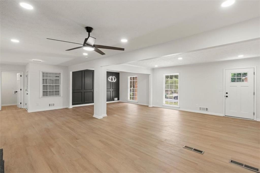 4328 Luxembourg Drive Decatur, GA 30034 - Photo 16 of 27 an empty room with wooden floor and windows