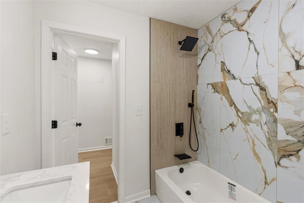 4328 Luxembourg Drive Decatur, GA 30034 - Photo 21 of 27 a bathroom with a bathtub and a shower