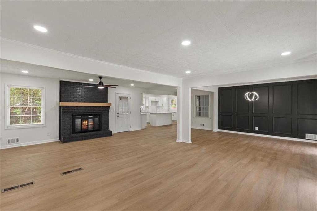 4328 Luxembourg Drive Decatur, GA 30034 - Photo 5 of 27 an empty room with a fireplace and window