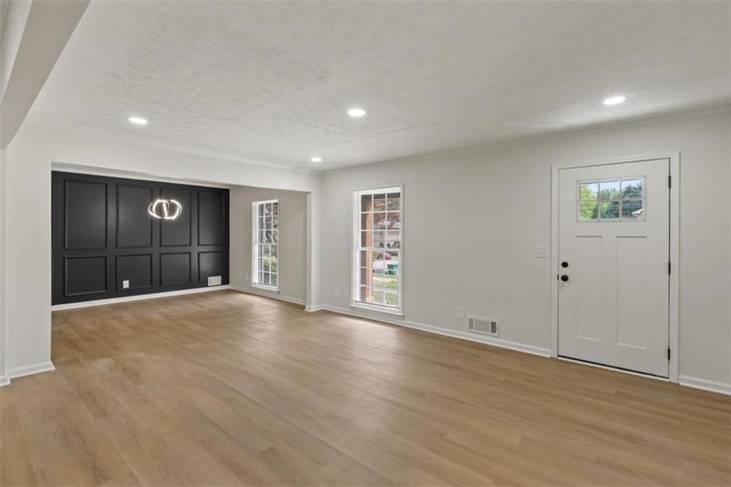 4328 Luxembourg Drive Decatur, GA 30034 - Photo 6 of 27 a view of an empty room with wooden floor