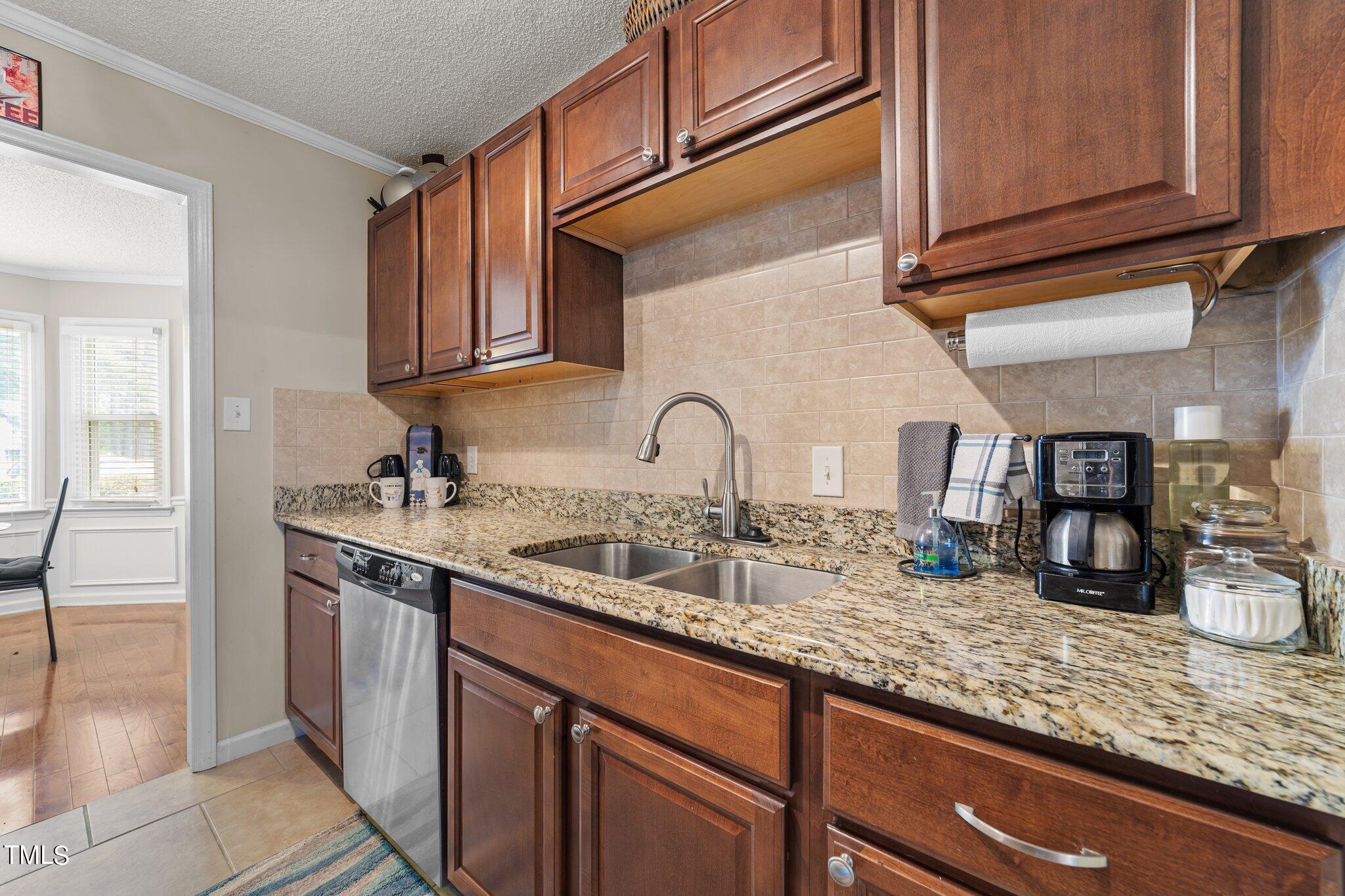 4600 Jacqueline Lane Raleigh, NC 27616 - Photo 11 of 34 a kitchen with sink and cabinets