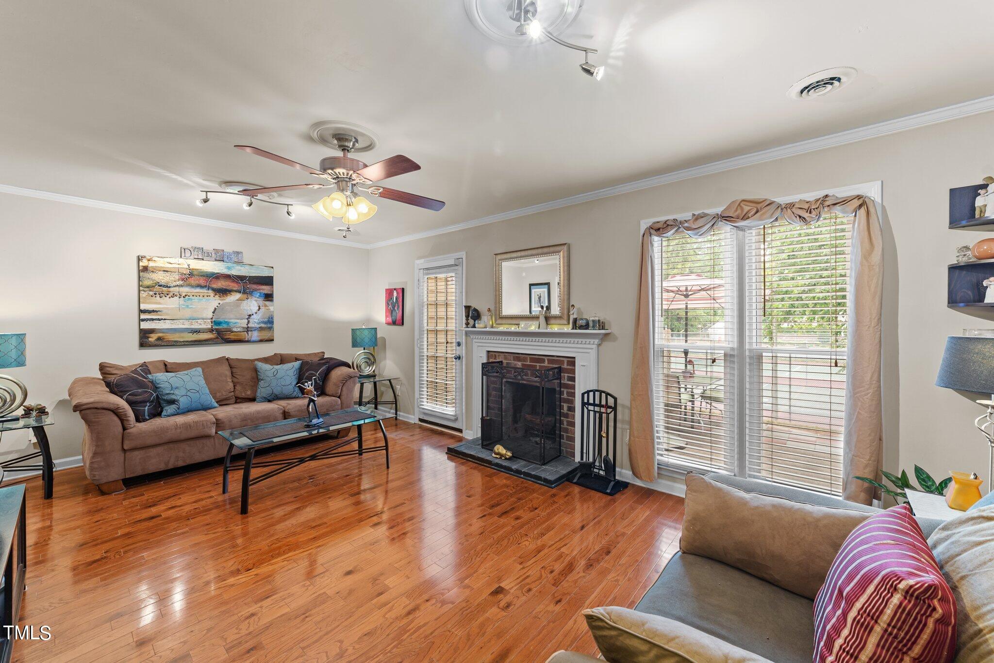 4600 Jacqueline Lane Raleigh, NC 27616 - Photo 13 of 34 a living room with furniture and a fireplace