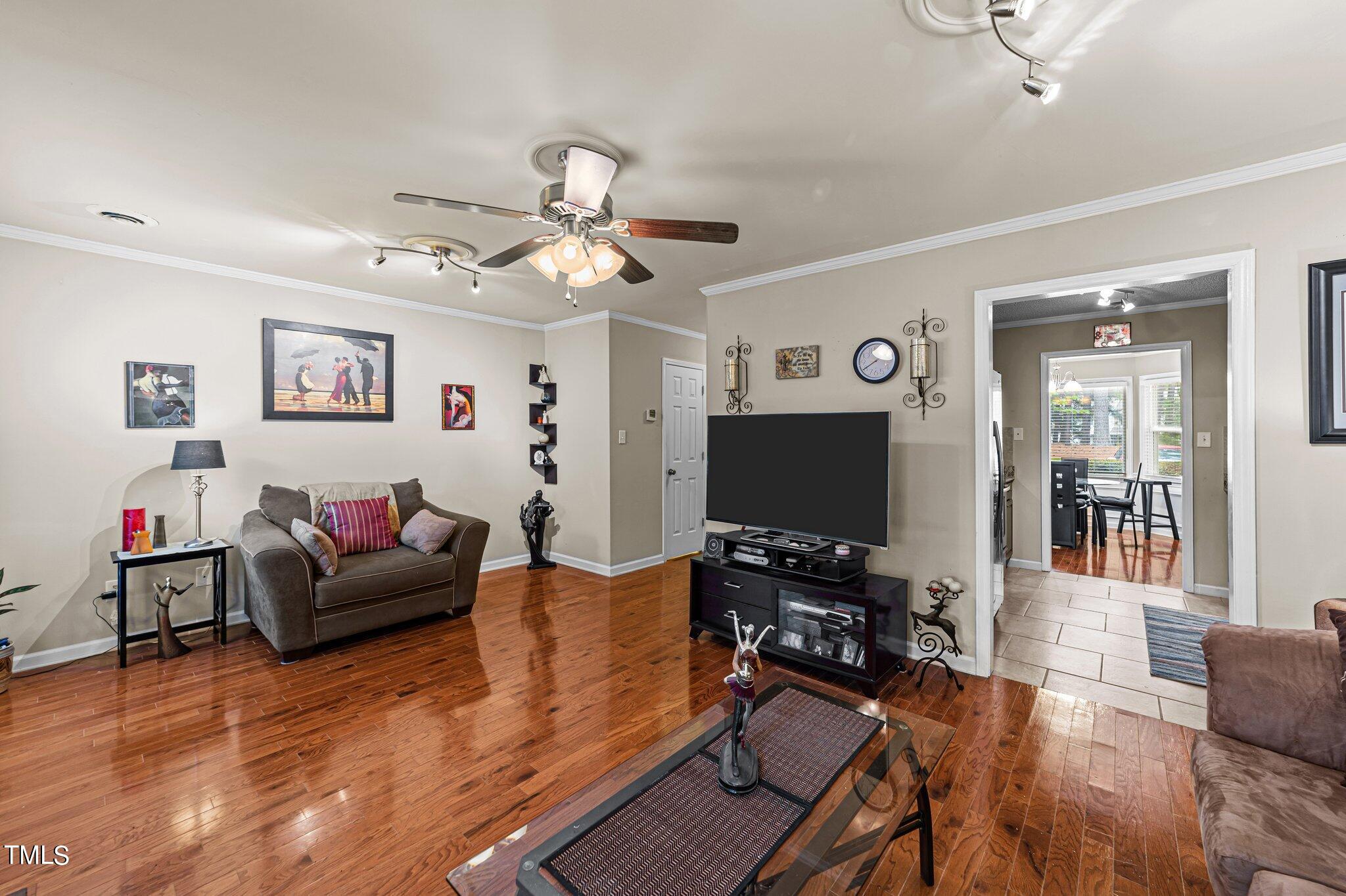 4600 Jacqueline Lane Raleigh, NC 27616 - Photo 14 of 34 a living room with furniture and a flat screen tv