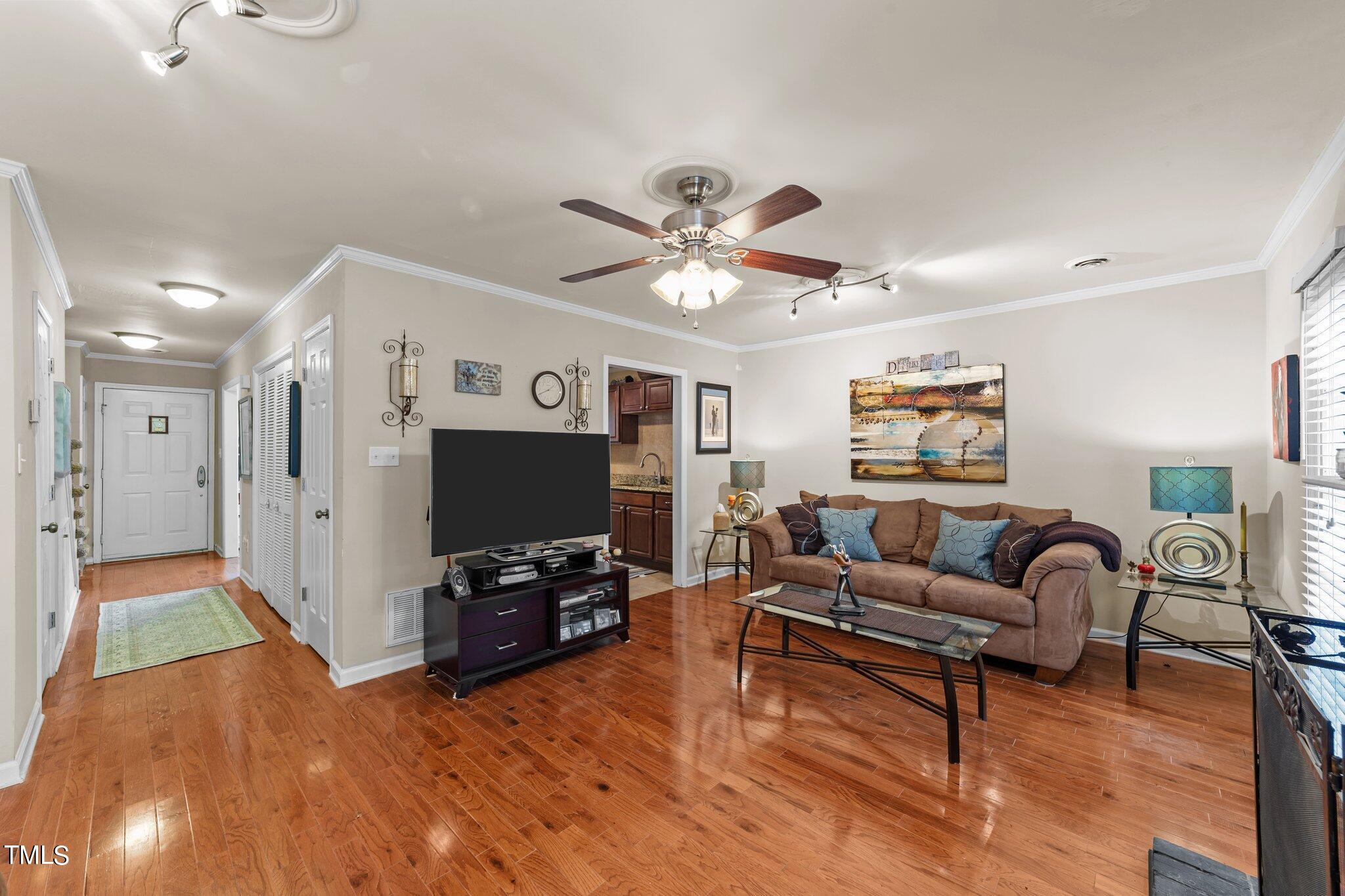 4600 Jacqueline Lane Raleigh, NC 27616 - Photo 15 of 34 a living room with furniture and a flat screen tv