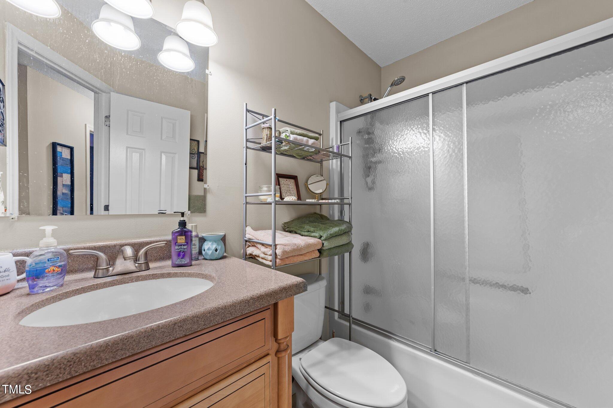 4600 Jacqueline Lane Raleigh, NC 27616 - Photo 17 of 34 a bathroom with a sink toilet and shower