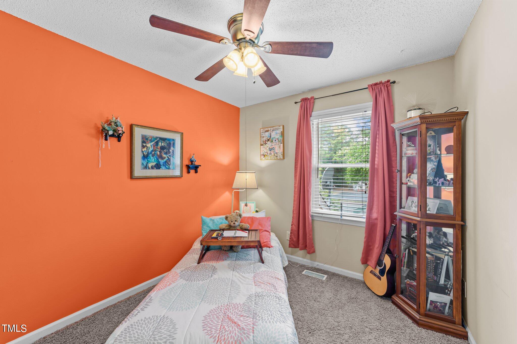 4600 Jacqueline Lane Raleigh, NC 27616 - Photo 18 of 34 a bedroom with furniture and a window