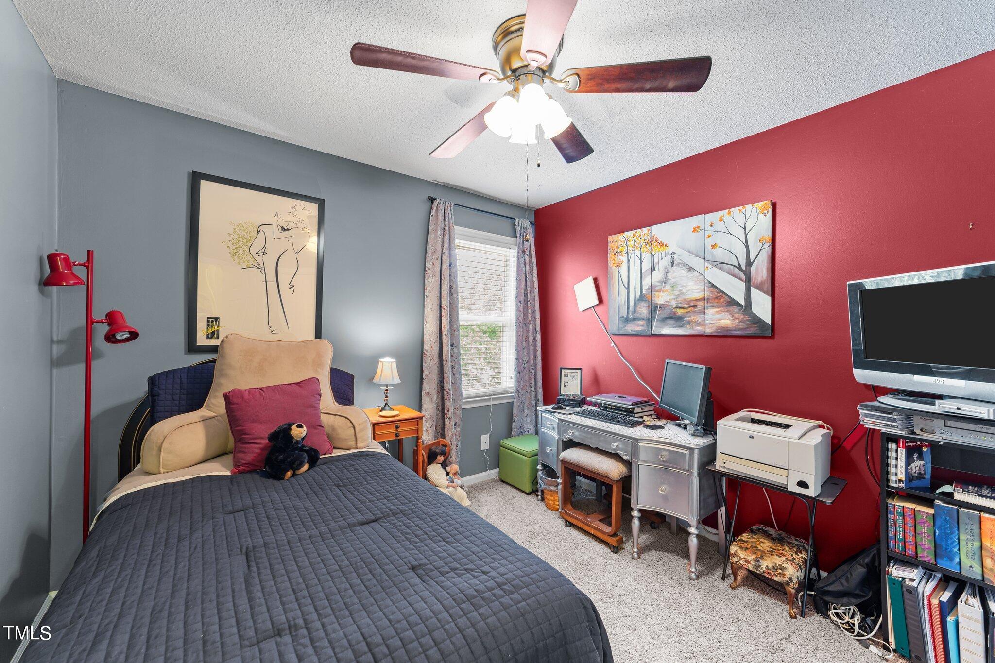 4600 Jacqueline Lane Raleigh, NC 27616 - Photo 20 of 34 a bedroom with furniture and a flat screen tv