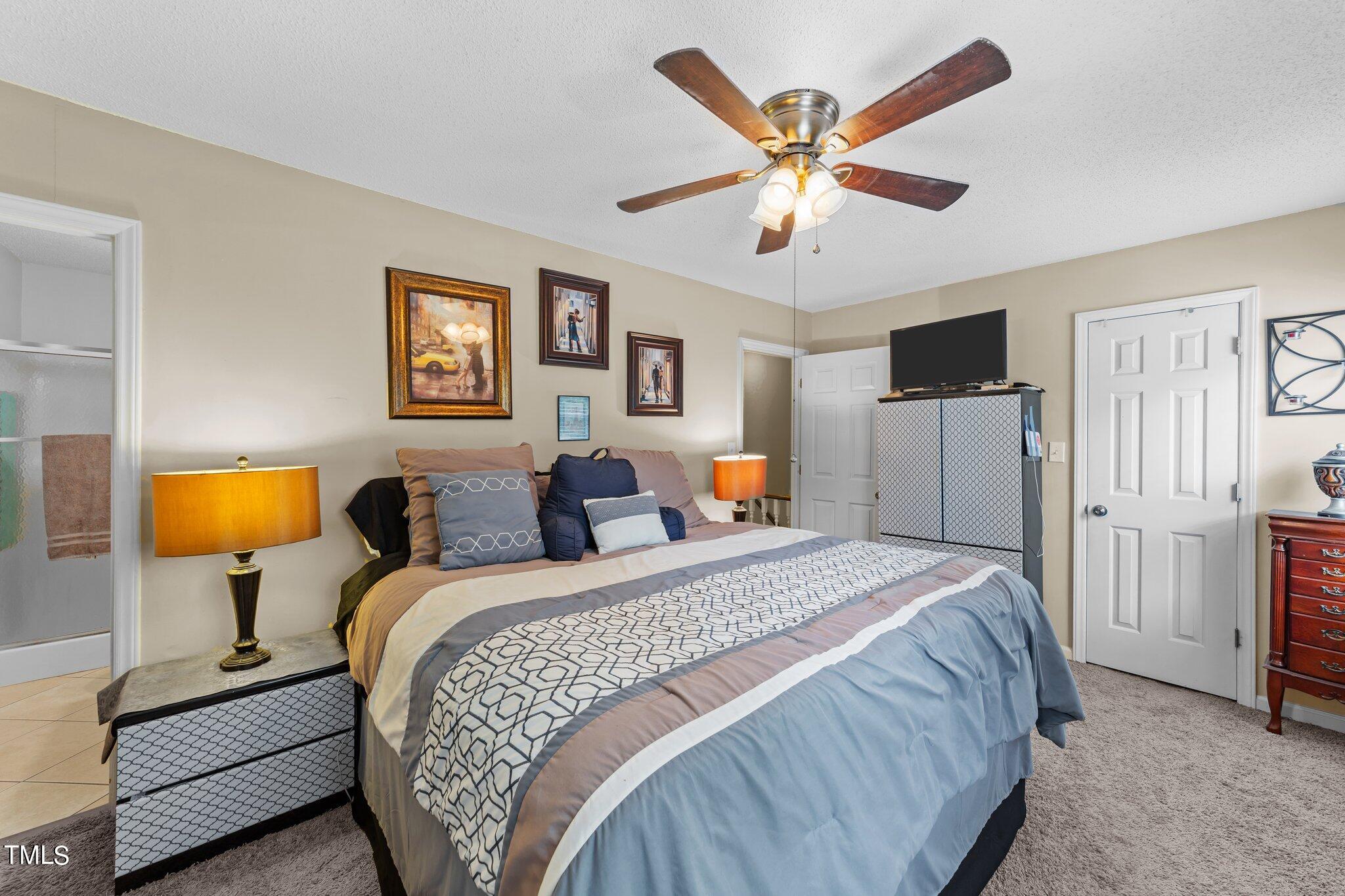 4600 Jacqueline Lane Raleigh, NC 27616 - Photo 22 of 34 a bedroom with bed and window