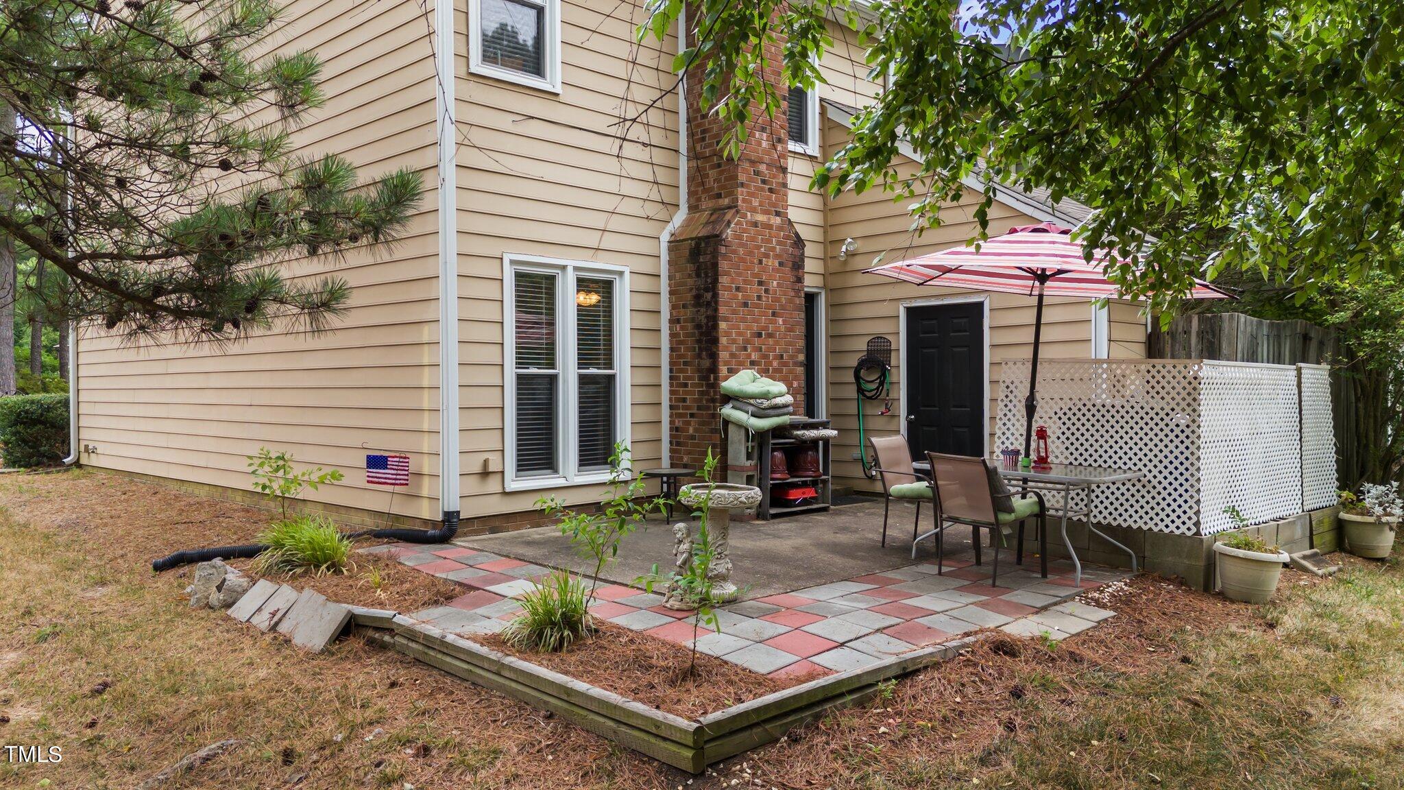 4600 Jacqueline Lane Raleigh, NC 27616 - Photo 31 of 34 a table and chairs in front of a house