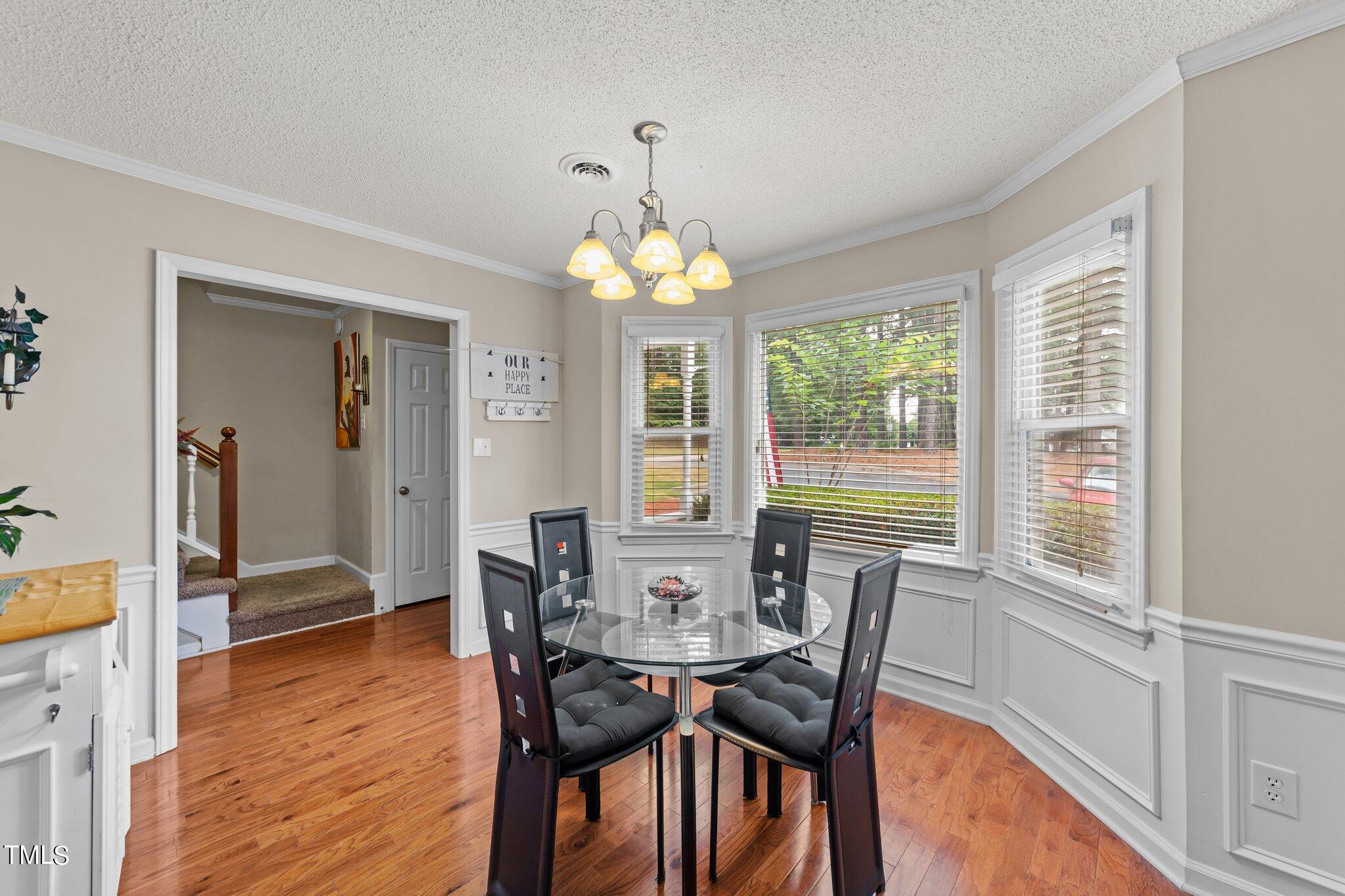 4600 Jacqueline Lane Raleigh, NC 27616 - Photo 5 of 34 a view of a dining room with furniture window and wooden floor