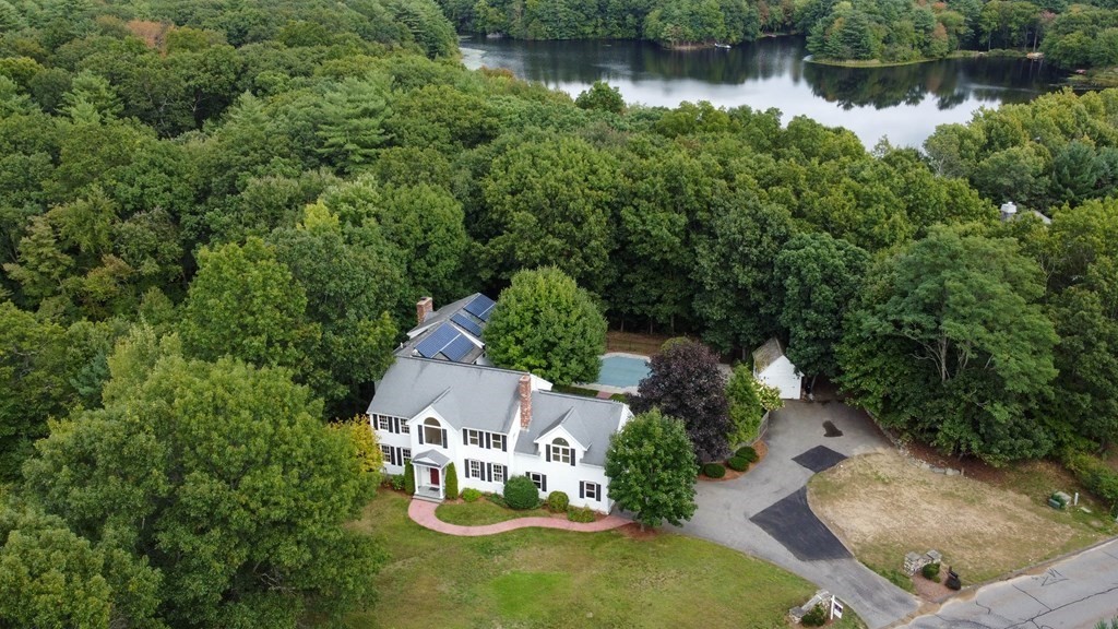 an aerial view of a house with lake view
