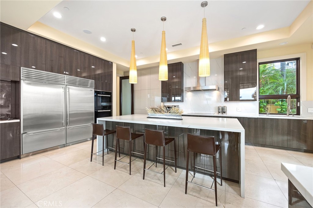 105 Oak Grove Monrovia, CA 91016 - Photo 14 of 46 a kitchen with kitchen island a sink stove and refrigerator