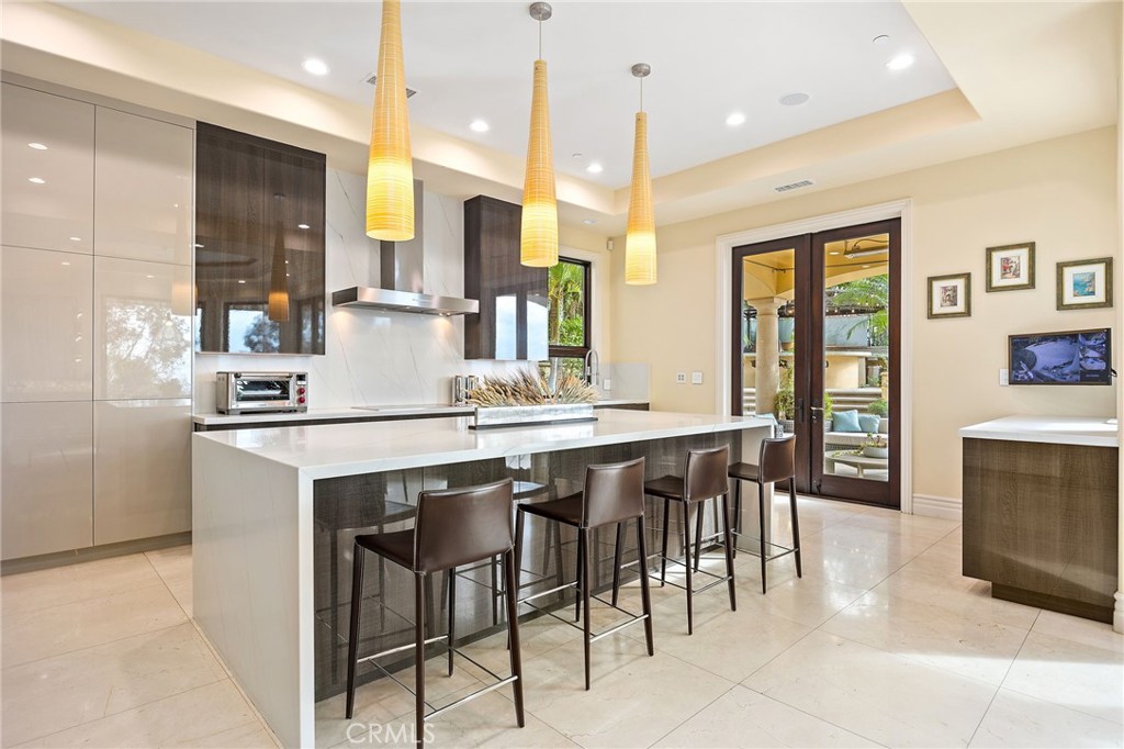 105 Oak Grove Monrovia, CA 91016 - Photo 15 of 46 a kitchen with a table chairs refrigerator and microwave