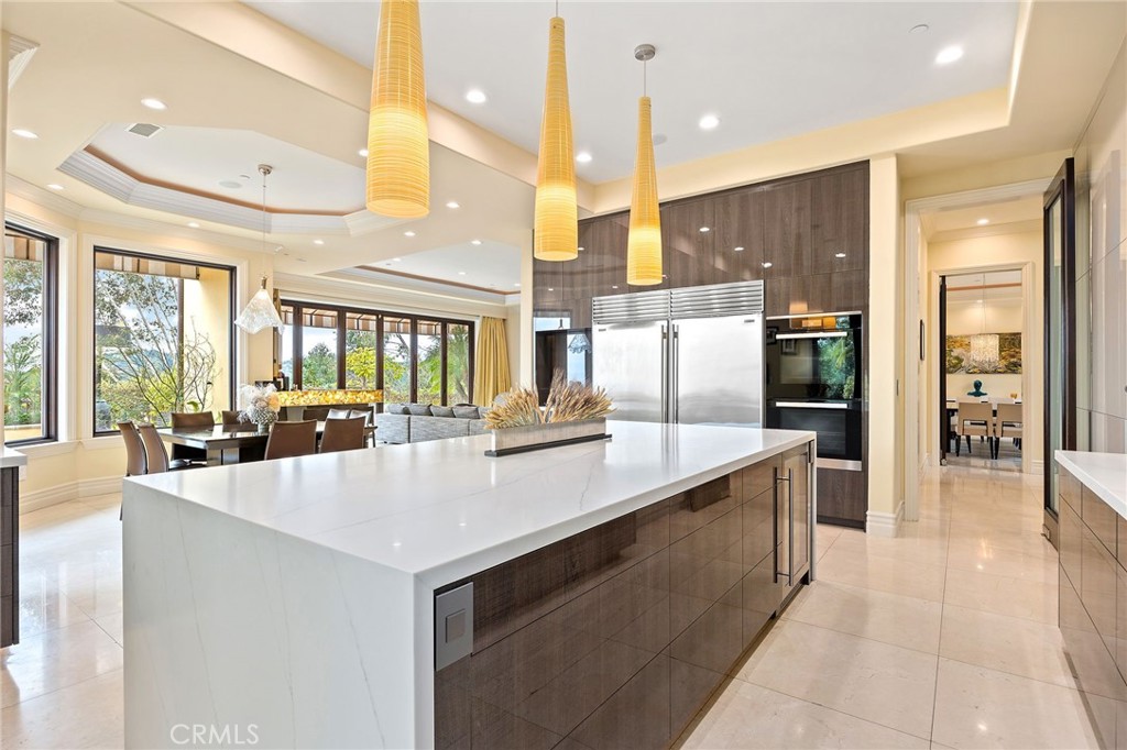 105 Oak Grove Monrovia, CA 91016 - Photo 16 of 46 a large kitchen with a large counter top appliances and furniture