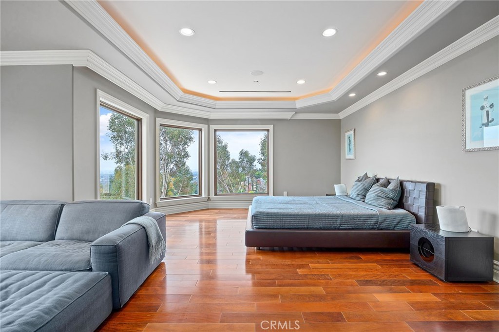 105 Oak Grove Monrovia, CA 91016 - Photo 26 of 46 a spacious bedroom with a large bed and a large window