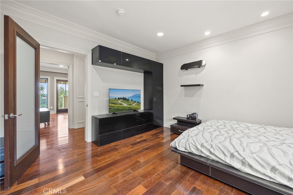 105 Oak Grove Monrovia, CA 91016 - Photo 33 of 46 a bedroom with a bed and a flat screen tv