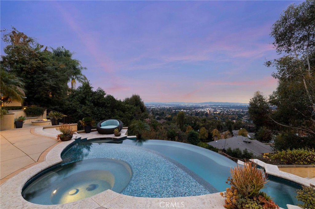 105 Oak Grove Monrovia, CA 91016 - Photo 4 of 46 Heated spa with a 'baja shelf', and infinity pool surrounded by beautiful foliage.