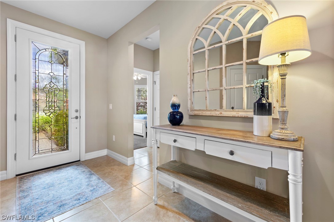 10853 Rutherford Road Fort Myers, FL 33913 - Photo 3 of 42 a spacious bathroom with a granite countertop double vanity and a mirror