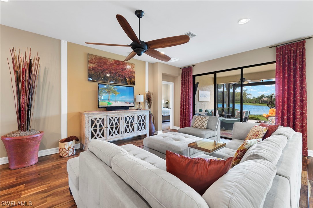 10853 Rutherford Road Fort Myers, FL 33913 - Photo 7 of 42 a living room with furniture and a large window