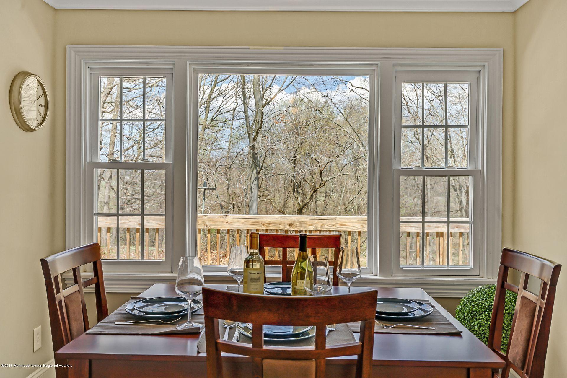 8 Saddle Ridge Road Colts Neck, NJ 07722 - Photo 14 of 35 a living room with furniture and a window