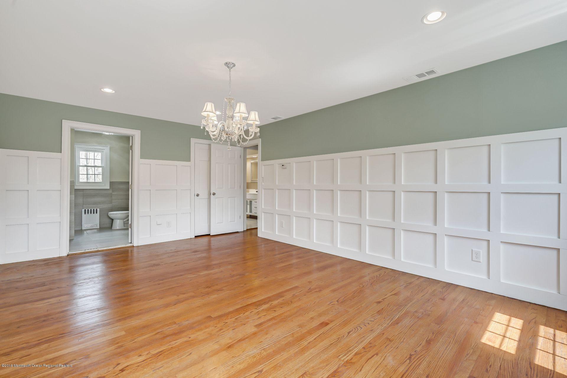 8 Saddle Ridge Road Colts Neck, NJ 07722 - Photo 20 of 35 wooden floor in an empty room with a window