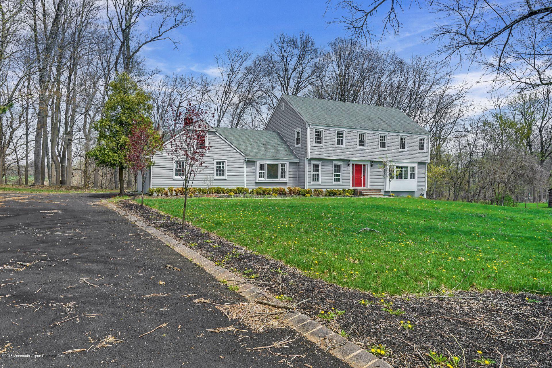 8 Saddle Ridge Road Colts Neck, NJ 07722 - Photo 22 of 35 a front view of house with yard and green space