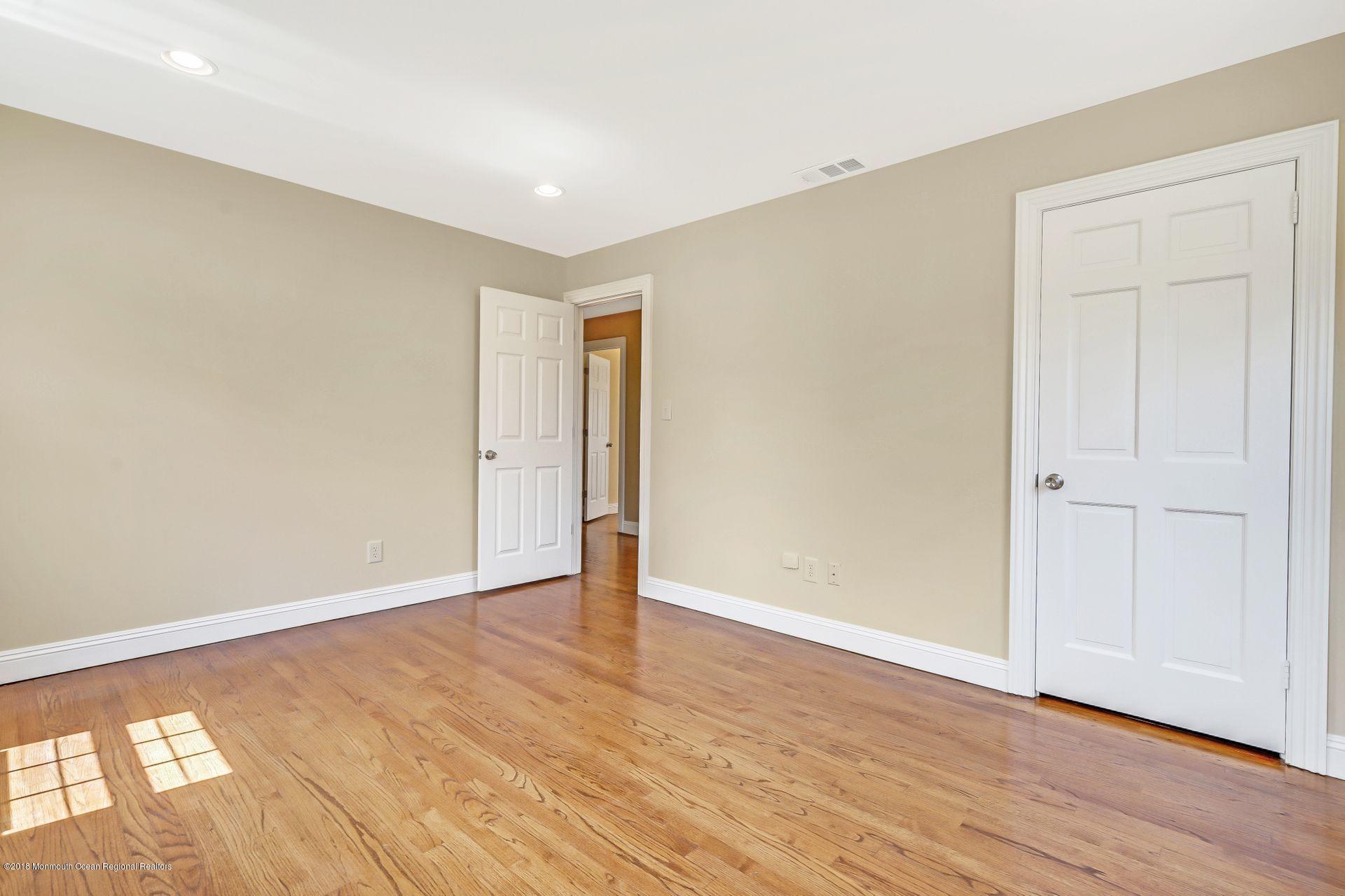 8 Saddle Ridge Road Colts Neck, NJ 07722 - Photo 26 of 35 wooden floor in an empty room